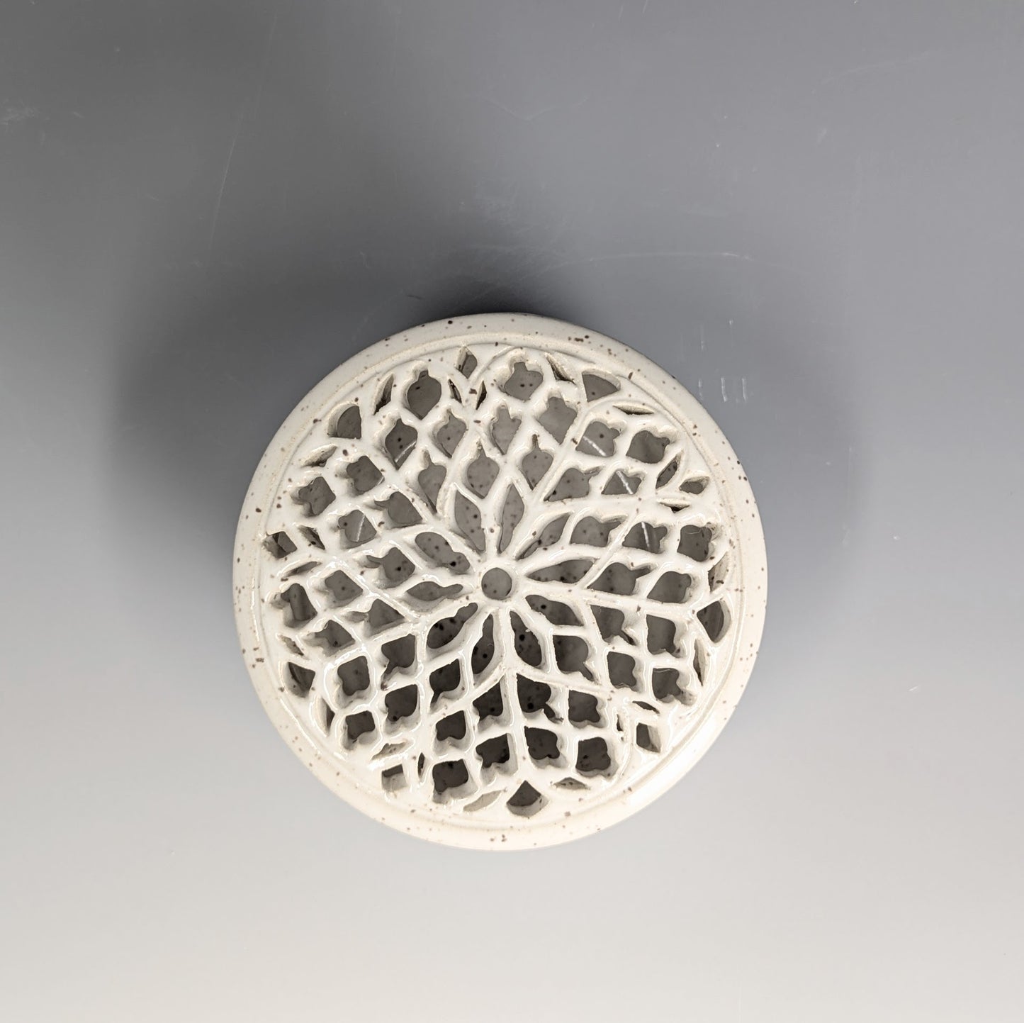 Lidded jar with Rose Window design
